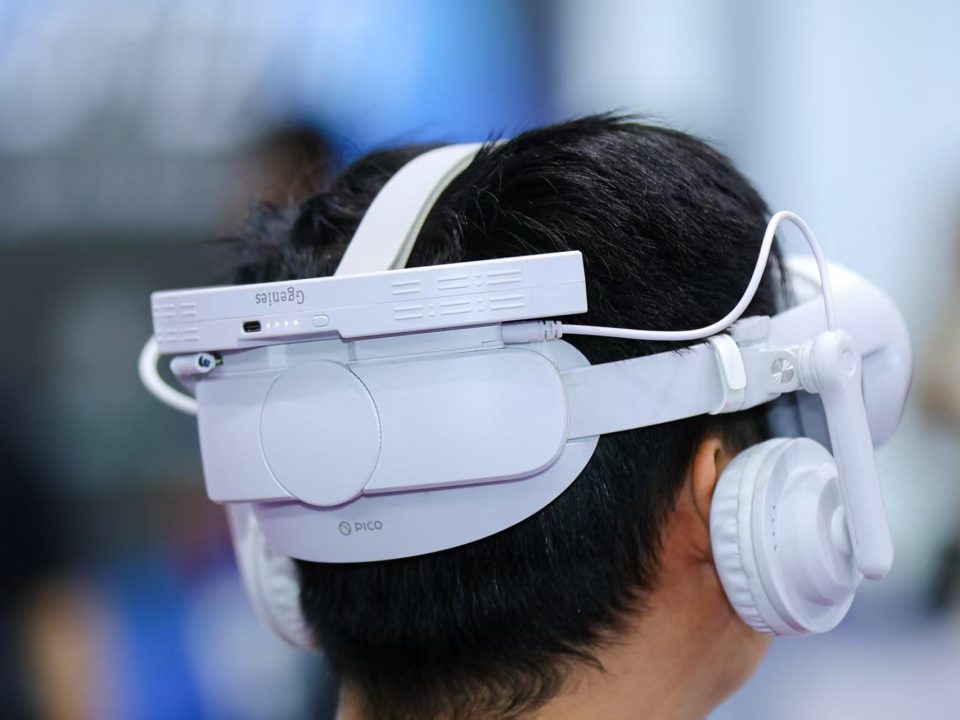Side view of the MAXXVR audio kit on a PICO 4 headset