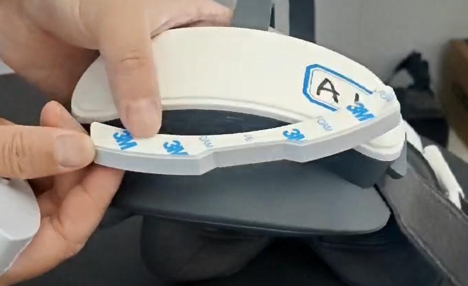 Removing the adhesive backing from the MAXXVR magnetic battery base